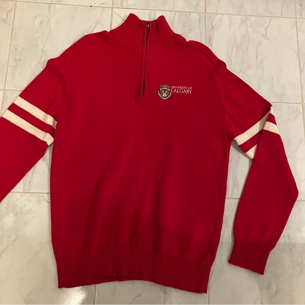 University of Calgary red long sleeve sweater.  Stripes on sleeve. Like new!